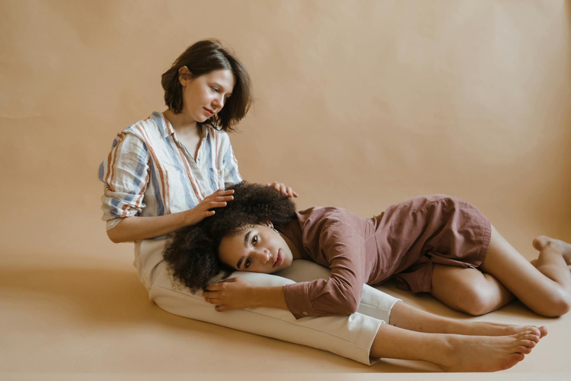 woman in brown long sleeve dress lying down
